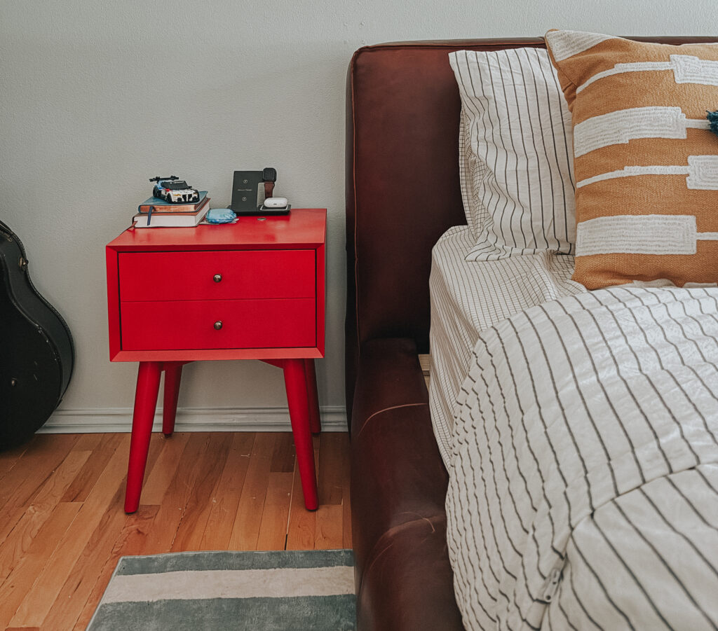 red nightstand, porsche art, striped bedding